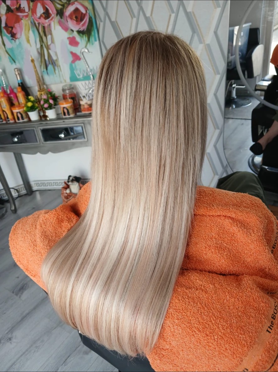 Long, sleek blonde hair extensions