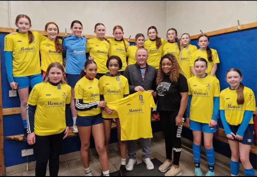 A local Wexford girls' team in yellow jerseys sponsored by Monica's Hair Extensions